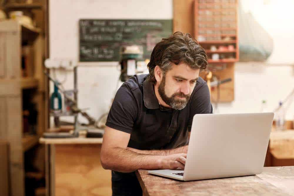 Male,Designer,And,Craftsman,With,A,Rugged,Beard,,Working,On